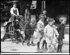 Children Pull Cart Major Street